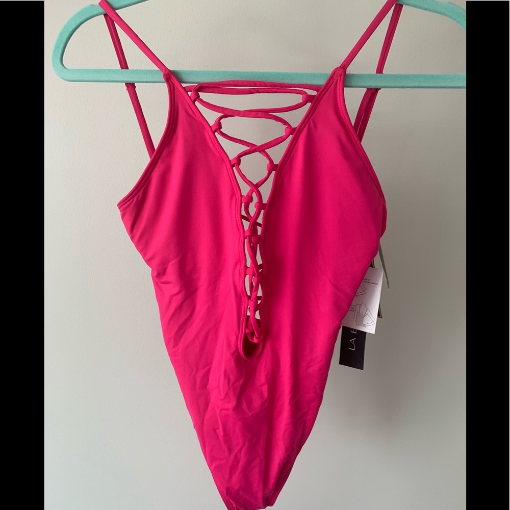 Deep V/ low back cris-cross fuscia one piece